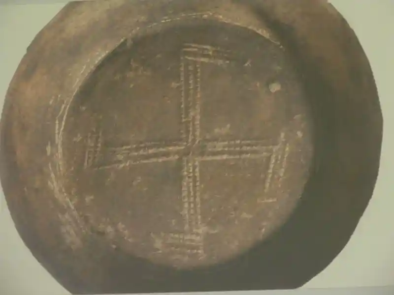Swastika at the bottom of a vessel